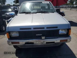 1987 Nissan Hardbody E z VIN JN6ND11S1HW030629, wystawiony jako Copart lot #65657004 z przebiegiem 181 228 mil mil oraz Szkody całkowita. Historia ofert i sprzedaży dostępna na DreamBid. Obrazek 5.