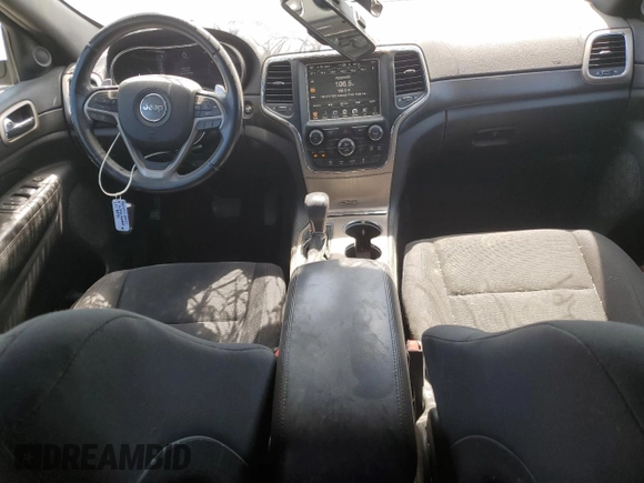 2016 Jeep Grand Cherokee Laredo with VIN 1C4RJFAG2GC328841, listed as a Copart auction lot 63553435 with 100,472 mi miles and Salvage title. Bid and sale history available at DreamBid. Image 8.