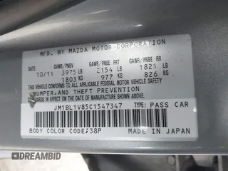 2012 Mazda 3 i Touring z VIN JM1BL1V85C1547347, wystawiony jako IAAI lot #42461435 z przebiegiem 141 842 mil mil oraz . Historia ofert i sprzedaży dostępna na DreamBid. Obrazek 9.