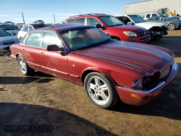 1999 Jaguar XJ with VIN SAJPX1849XC857869, listed as a Copart auction lot 83773914 with 172,496 mi miles and Clean title. Bid and sale history available at DreamBid. Image 4.