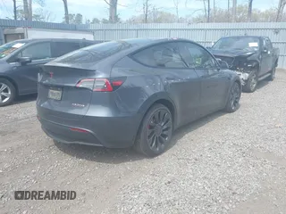 2022 Tesla Model Y Performance with VIN 7SAYGDEF3NF324705, listed as a IAAI auction lot 42076565 with 66,573 mi miles and . Bid and sale history available at carsss.com. Image 4.