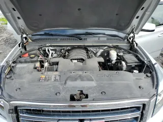 2015 GMC Yukon SLT with VIN 1GKS2BKC9FR518381, listed as a Copart auction lot 66352864 with 103,419 mi miles and Salvage Title. Bid and sale history available at carsss.com. Image 12.