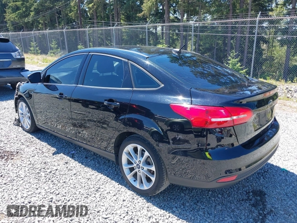 2018 Ford Focus SE z VIN 1FADP3FE5JL279274, wystawiony jako IAAI lot #42626587 z przebiegiem 92 110 mil mil oraz . Historia ofert i sprzedaży dostępna na DreamBid. Obrazek 3.