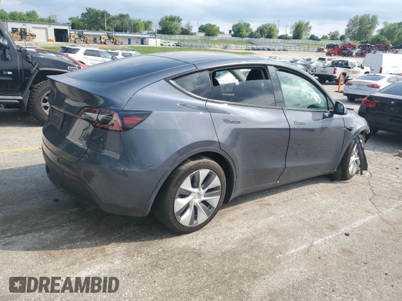 2023 Tesla Model Y Long Range z VIN 7SAYGDEE2PA041350, wystawiony jako Copart lot #56657005 z przebiegiem 25 090 mil mil oraz Szkoda całkowita • Salvage title. Historia ofert i sprzedaży dostępna na DreamBid. Obrazek 3.
