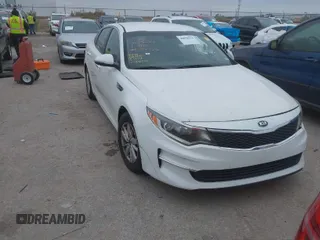 2016 Kia Optima LX with VIN KNAGT4L39G5104726, listed as a IAAI auction lot 40950914 with 128,728 mi miles. Bid and sale history available at carsss.com. Image 1.