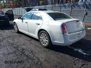 2013 Chrysler 300 with VIN 2C3CCAKGXDH733148, listed as a IAAI auction lot 41541442 with 216,074 mi miles. Bid and sale history available at carsss.com. Image 3.