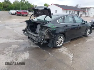 2019 Ford Fusion Hybrid SEL with VIN 3FA6P0MU1KR202860, listed as a IAAI auction lot 41983299 with 133,671 mi miles. Bid and sale history available at carsss.com. Image 4.