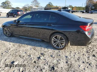 2016 BMW 7 Series 750i with VIN WBA7F0C5XGGL99048, listed as a Copart auction lot 84815364 with 96,743 mi miles and Salvage Title. Bid and sale history available at carsss.com. Image 2.