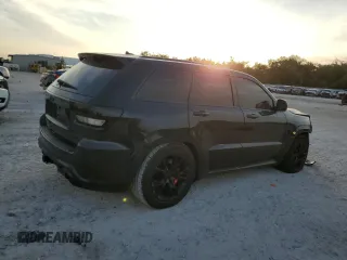 2012 Jeep Grand Cherokee SRT8 with VIN 1C4RJFDJ2CC329621, listed as a Copart auction lot 86772154 with 236,800 mi miles and Salvage Title. Bid and sale history available at carsss.com. Image 3.