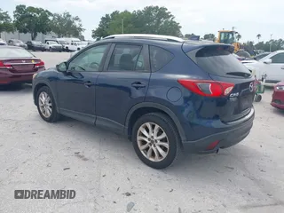 2014 Mazda CX-5 Grand Touring with VIN JM3KE2DY8E0425258, listed as a IAAI auction lot 42179452 with 132,137 mi miles. Bid and sale history available at carsss.com. Image 3.