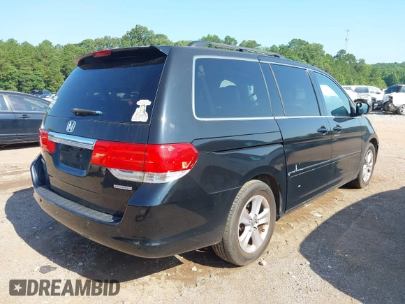 2010 Honda Odyssey Touring with VIN 5FNRL3H97AB104359, listed as a IAAI auction lot 42555872 with 233,952 mi miles and . Bid and sale history available at DreamBid. Image 4.