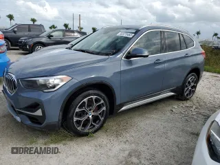 2021 BMW X1 sDrive28i z VIN WBXJG7C03M5T49590, wystawiony jako Copart lot #52473453 z przebiegiem 19 199 mil mil oraz Nie do naprawy. Historia ofert i sprzedaży dostępna na DreamBid. Obrazek 1.