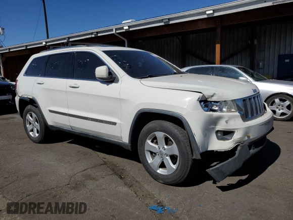 2011 Jeep Grand Cherokee Laredo with VIN 1J4RR4GG3BC671780, listed as a Copart auction lot 49179835 with 166,521 mi miles and Salvage Title. Bid and sale history available at carsss.com. Image 4.