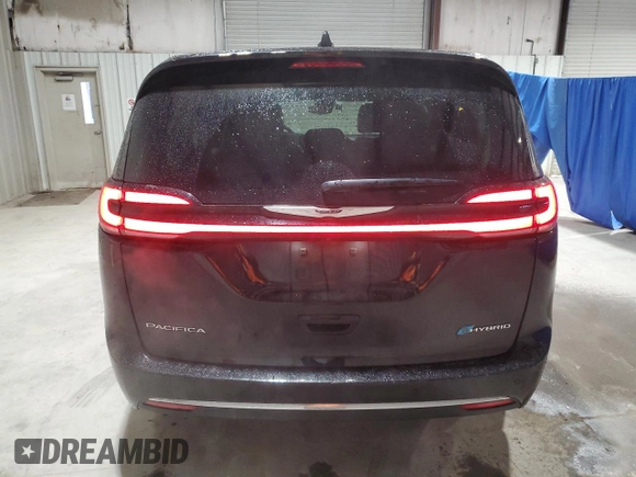 2024 Chrysler Pacifica Hybrid Select z VIN 2C4RC1S7XRR166687, wystawiony jako Copart lot #52501305 z przebiegiem 35 781 mil mil oraz Czysty tytuł • Clean title. Historia ofert i sprzedaży dostępna na DreamBid. Obrazek 6.