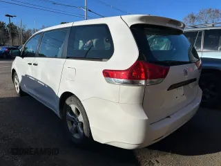 2014 Toyota Sienna L with VIN 5TDZK3DC7ES448022, listed as a Copart auction lot 52548605 with 202,484 mi miles and Clean Title. Bid and sale history available at carsss.com. Image 4.
