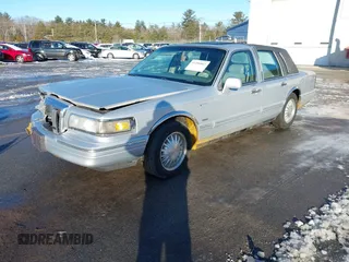 1997 Lincoln Town Car Cartier with VIN 1LNLM83W9VY661126, listed as a IAAI auction lot 41456847 with 160,710 mi miles and . Bid and sale history available at DreamBid. Image 17.
