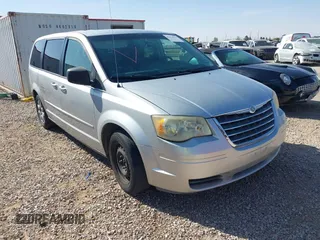 2009 Chrysler Town & Country LX with VIN 2A8HR44E09R566418, listed as a IAAI auction lot 41874967 with 207,665 mi miles. Bid and sale history available at carsss.com. Image 1.