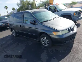 2002 Honda Odyssey EX z VIN 2HKRL18632H512158, wystawiony jako IAAI lot #42354621 z przebiegiem 240 373 mil mil oraz . Historia ofert i sprzedaży dostępna na DreamBid. Obrazek 1.