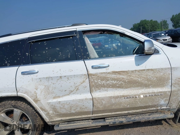 2015 Jeep Grand Cherokee Overland with VIN 1C4RJFCGXFC880096, listed as a IAAI auction lot 42706085 with 74,044 mi miles and . Bid and sale history available at DreamBid. Image 13.