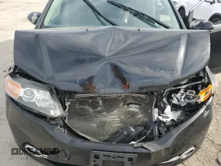 2014 Honda Odyssey Touring z VIN 5FNRL5H94EB006827, wystawiony jako Copart lot #55859715 z przebiegiem 195 131 mil mil oraz Szkoda całkowita • Salvage title. Historia ofert i sprzedaży dostępna na DreamBid. Obrazek 11.