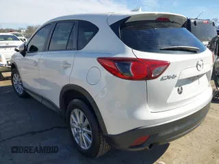 2016 Mazda CX-5 Sport with VIN JM3KE2BY9G0890587, listed as a IAAI auction lot 41685344 with 91,190 mi miles. Bid and sale history available at carsss.com. Image 3.