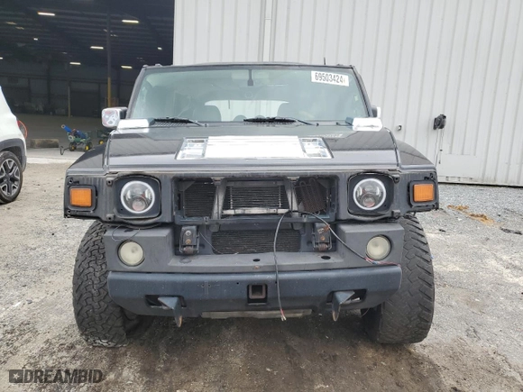 2003 Hummer H2 with VIN 5GRGN23UX3H121939, listed as a Copart auction lot 69503424 with 170,144 mi miles and Salvage Title. Bid and sale history available at carsss.com. Image 5.