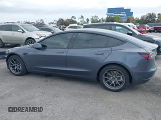 2023 Tesla Model 3 with VIN 5YJ3E1EA4PF410060, listed as a IAAI auction lot 42067624 with 59,934 mi miles and . Bid and sale history available at DreamBid. Image 14.