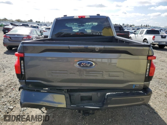 2023 Ford F-150 Lightning Pro z VIN 1FT6W1EV4PWG42053, wystawiony jako Copart lot #50003045 z przebiegiem 29 320 mil mil oraz Szkody całkowita. Historia ofert i sprzedaży dostępna na DreamBid. Obrazek 6.