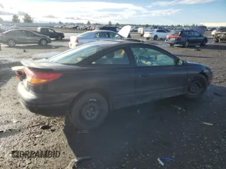 2000 Saturn SC with VIN 1G8ZY1273YZ152453, listed as a Copart auction lot 84834784 with Not Provided miles and Salvage Title. Bid and sale history available at carsss.com. Image 3.