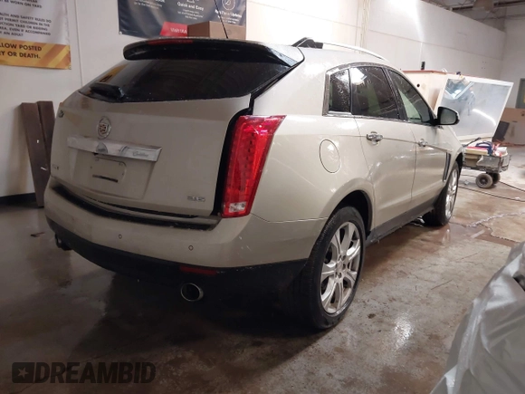2015 Cadillac SRX Premium Collection with VIN 3GYFNDE32FS623153, listed as a IAAI auction lot 41577809 with 149,932 mi miles. Bid and sale history available at carsss.com. Image 4.