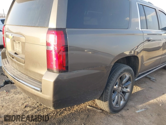 2015 Chevrolet Suburban LTZ with VIN 1GNSKKKC1FR628182, listed as a IAAI auction lot 41801391 with Not Provided miles and . Bid and sale history available at DreamBid. Image 4.