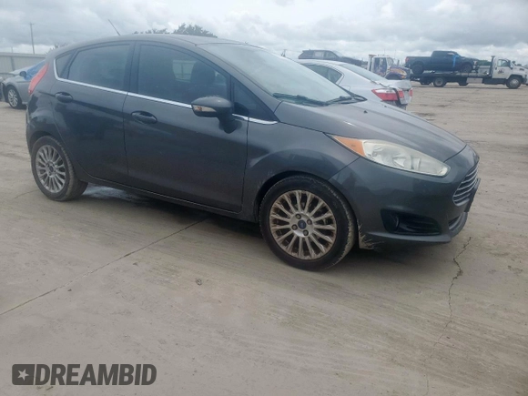 2015 Ford Fiesta Titanium z VIN 3FADP4FJ5FM203174, wystawiony jako Copart lot #60727515 z przebiegiem 91 898 mil mil oraz Czysty tytuł • Clean title. Historia ofert i sprzedaży dostępna na DreamBid. Obrazek 4.