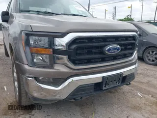 2023 Ford F-150 XL with VIN 1FTFW1E81PFB71702, listed as a IAAI auction lot 42102699 with 57,007 mi miles. Bid and sale history available at carsss.com. Image 6.