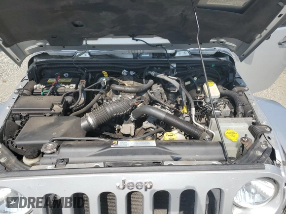 2009 Jeep Wrangler Sahara with VIN 1J4FA54119L747068, listed as a Copart auction lot 71209904 with 86,978 mi miles and Salvage title. Bid and sale history available at DreamBid. Image 12.