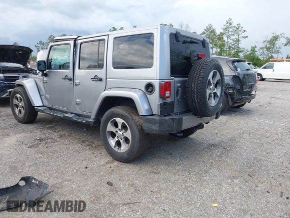 2016 Jeep Wrangler Unlimited Sahara with VIN 1C4BJWEG3GL240859, listed as a IAAI auction lot 42628937 with 103,378 mi miles and . Bid and sale history available at DreamBid. Image 3.