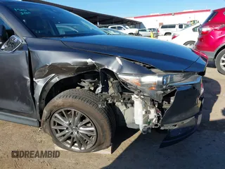 2017 Mazda CX-5 Touring with VIN JM3KFBCL2H0165625, listed as a IAAI auction lot 41879145 with 64,745 mi miles. Bid and sale history available at carsss.com. Image 6.