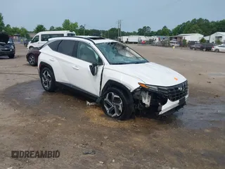2022 Hyundai Tucson SEL z VIN 5NMJC3AE3NH057663, wystawiony jako IAAI lot #42428386 z przebiegiem 78 740 mil mil oraz . Historia ofert i sprzedaży dostępna na DreamBid. Obrazek 1.
