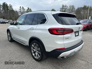 2019 BMW X5 xDrive40i with VIN 5UXCR6C56KLK99829, listed as a IAAI auction lot 41902835 with 165,939 mi miles. Bid and sale history available at carsss.com. Image 3.