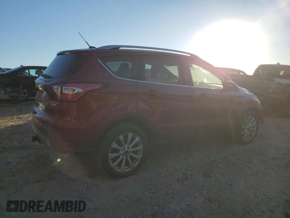 2017 Ford Escape Titanium with VIN 1FMCU0J94HUD34112, listed as a Copart auction lot 85837974 with 127,576 mi miles and Salvage Title. Bid and sale history available at carsss.com. Image 3.
