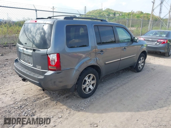 2011 Honda Pilot Touring with VIN 5FNYF4H90BB103824, listed as a IAAI auction lot 42127137 with 243,858 mi miles and . Bid and sale history available at carsss.com. Image 4.