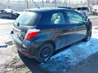 2012 Toyota Yaris L with VIN JTDJTUD33CD520102, listed as a IAAI auction lot 41621530 with 133,144 mi miles. Bid and sale history available at carsss.com. Image 4.