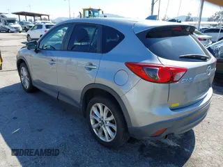 2014 Mazda CX-5 Grand Touring with VIN JM3KE2DY0E0331942, listed as a IAAI auction lot 41750533 with 163,387 mi miles. Bid and sale history available at carsss.com. Image 3.