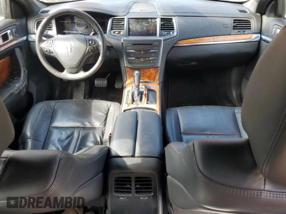 2015 Lincoln MKS with VIN 1LNHL9DK5FG607422, listed as a Copart auction lot 55613525 with 164,590 mi miles and Salvage title. Bid and sale history available at DreamBid. Image 8.