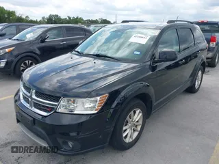 2015 Dodge Journey SXT with VIN 3C4PDCBG5FT604847, listed as a IAAI auction lot 42108853 with 164,679 mi miles. Bid and sale history available at carsss.com. Image 2.
