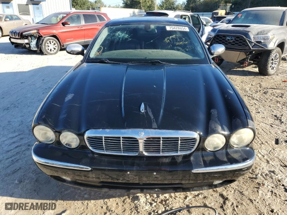 2005 Jaguar XJ VDP with VIN SAJWA82C05SG47513, listed as a Copart auction lot 75428654 with NaN miles and Salvage Title. Bid and sale history available at carsss.com. Image 5.