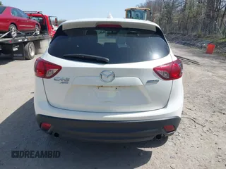 2016 Mazda CX-5 Grand Touring with VIN JM3KE4DY0G0632693, listed as a IAAI auction lot 42123142 with 106,592 mi miles. Bid and sale history available at carsss.com. Image 16.
