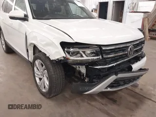 2021 Volkswagen Atlas SE z VIN 1V2HR2CA3MC539997, wystawiony jako IAAI lot #41977786 z przebiegiem 77 372 mil mil oraz . Historia ofert i sprzedaży dostępna na DreamBid. Obrazek 6.