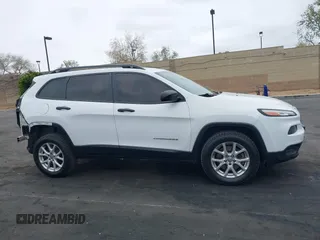 2015 Jeep Cherokee Sport z VIN 1C4PJMAB7FW635080, wystawiony jako IAAI lot #42062096 z przebiegiem 237 636 mil mil oraz . Historia ofert i sprzedaży dostępna na DreamBid. Obrazek 14.