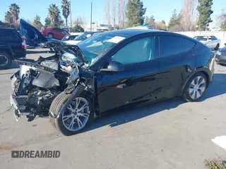 2024 Tesla Model Y Long Range with VIN 7SAYGAEE7RF014424, listed as a IAAI auction lot 41402098 with 6,052 mi miles and . Bid and sale history available at DreamBid. Image 19.