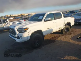 2023 Toyota Tacoma 4WD SR with VIN 3TMCZ5AN8PM647845, listed as a IAAI auction lot 41371634 with 21,917 mi miles. Bid and sale history available at carsss.com. Image 2.